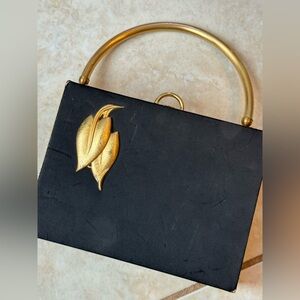 Rare vintage Evans handbag in black satin/gold metal.